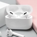 Close-up of white wireless earbuds