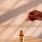 Skincare serum being applied from a dropper bottle